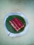 Delicious red velvet cake served on a plate made from banana leaf and recycled paper, magazine or phamplet