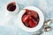 Delicious red wine poached pears in spicy syrup