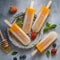 Delicious refreshing homemade popsicles made with fresh fruit juice viewed from above