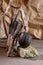 Delicious and ripe avacado stands on natural stones. Composition from balancing objects.Monochrome vertical creative composition