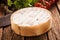 Delicious ripe French camembert cheese in a box