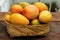 Delicious ripe juicy mangos on wooden table, closeup