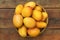 Delicious ripe juicy mangos on wooden table, top view