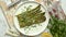 Delicious roasted asparagus served on white ceramic plate. With parmesan cheese, parsley and lemon.