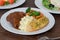 Delicious roasted beef with gravy, mashed potatoes veggies and sliced garlic bread on a plate