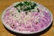 The delicious Russian dish herring under coat on the plate