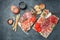 Delicious salami, pieces of sliced prosciutto crudo, sausage and wine. Meat platter. Mixed delicatessen of meat snacks. place for