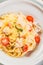 Delicious salmon linguine pasta dish with herbs and grilled salmon filet