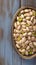 Delicious salted pistachio nuts showcased on rustic wooden background