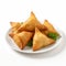 Delicious Samosa With Fresh Herbs On White Plate