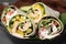 Delicious sandwich wraps with fresh vegetables on grey table, closeup