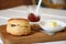 Delicious scone with butter and strawberry jam