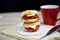 Delicious scone dessert with red cup coffee backgrounds