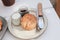 Delicious scones with Strawberry Jam and Clotted Cream on white table.