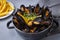 Delicious seafood mussels with parsley sauce and lemon. Delicious steamed mussels