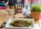 Delicious seared fish fillet with wine on restaurant background
