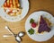 Delicious Set of cheesecakes with a Strawberry, crumbled cookies, Strawberry sauce drip and two spoons on wooden background. Top