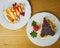 Delicious Set of cheesecakes with a Strawberry, Strawberry sauce drip and crumbled cookies on wooden background. Top View