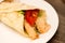 Delicious shawarma rolled sandwich with meat and vegetables