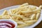 Delicious shoestring style french fries with ketchup