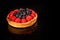 delicious shortbread mini tart with raspberries and blueberries
