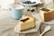 Delicious slice of new york cheesecake on grey background, isolated. Sweet and tasty food, coffee break concep. Classic american d