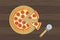 Delicious sliced pepperoni pizza and knife on wooden table top view