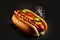 Delicious snack in form of fresh hotdog with sausage, pepper and cucumber isolated on black background