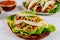 Delicious soft tortillas with salad and meat. Mexican cuisine