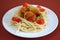 Delicious spaghetti with meatballs with tomatoes.