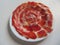 delicious Spanish Iberian ham cut with fantastic aromatic tasty knife