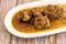 Delicious Spanish oxtail stew with white rice garnish