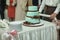 Delicious special blue wedding cake with brown ribbons and bows