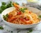 Delicious Spicy Shrimp Pad Thai in White Bowl Garnished with Fresh Herbs on Marble Kitchen Table