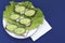 Delicious spring sandwiches with cream cheese, fresh cucumbers and salad leaves