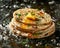 Delicious Stack of Golden Brown Pancakes Topped with Butter and Herbs on Dark Background