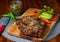 Delicious steak with green sauce and avocado