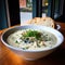 A delicious steaming bowl of creamy clam chowder.