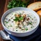 A delicious steaming bowl of creamy clam chowder.