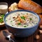 A delicious steaming bowl of creamy clam chowder.