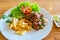 Delicious stir-fried beef with bell pepper and french fries