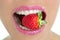 Delicious strawberry fruit in woman mouth