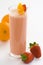 Delicious strawberry orange banana milkshake