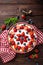 Delicious strawberry pie with fresh blueberry and whipped cream on wooden rustic table, cheesecake