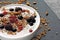 Delicious stylish breakfast with yogurt, granola and berries.