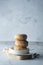 Delicious sugar donuts on a white plate, rustic style