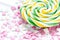 Delicious sugar lollipops on abstract candy background pattern