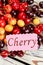 Delicious summer cherries on wooden background.