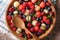 Delicious summer fruit salad in bowl closeup. horizontal top vie