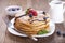 Delicious sweet American pancakes on a plate with fresh fruits